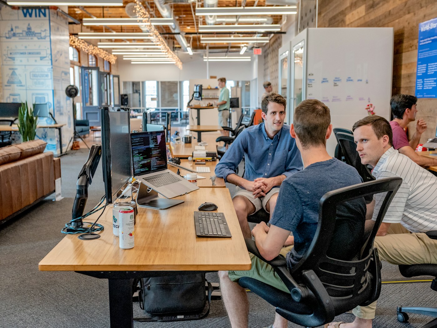 Marketing team reviewing analytics on a laptop